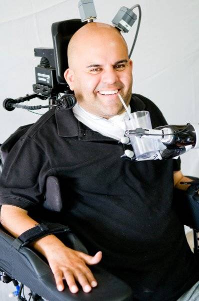 Giving himself a drink for the first time in 10 years, Sorto says, "This study has been very meaningful to me. As much as the project needed me, I needed the project. The project has made a huge difference in my life. It gives me great pleasure to be part of the solution for improving paralyzed patients' lives." Credit: Spencer Kellis and Christian Klaes/Caltech